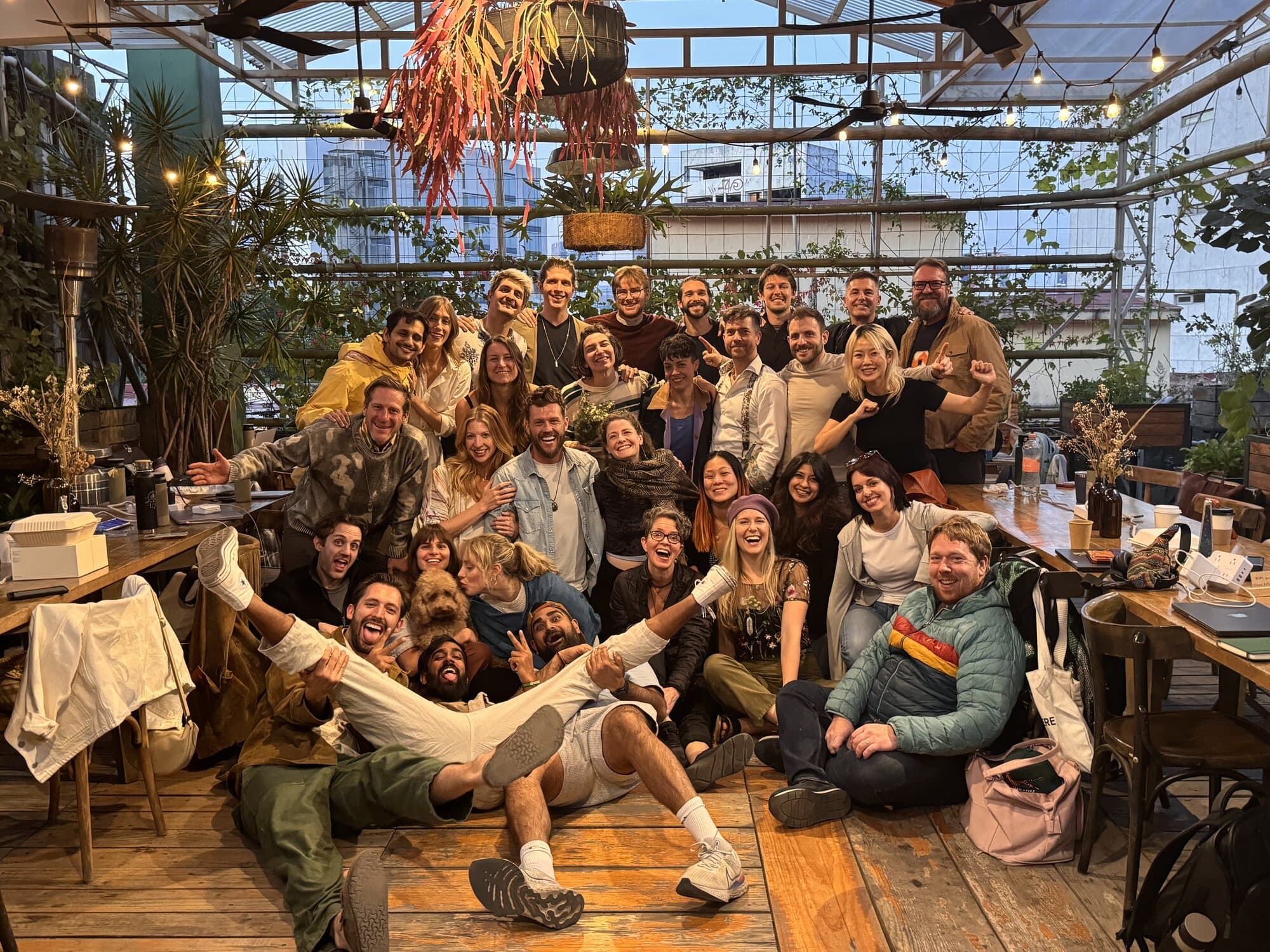 The whole group piled together for a photo in the greenhouse