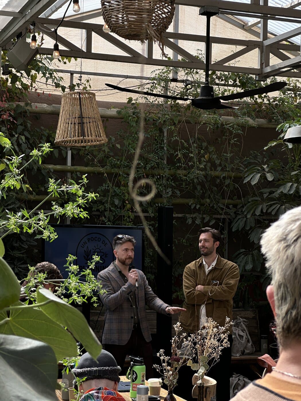 Two friends co-leading a session in the greenhouse