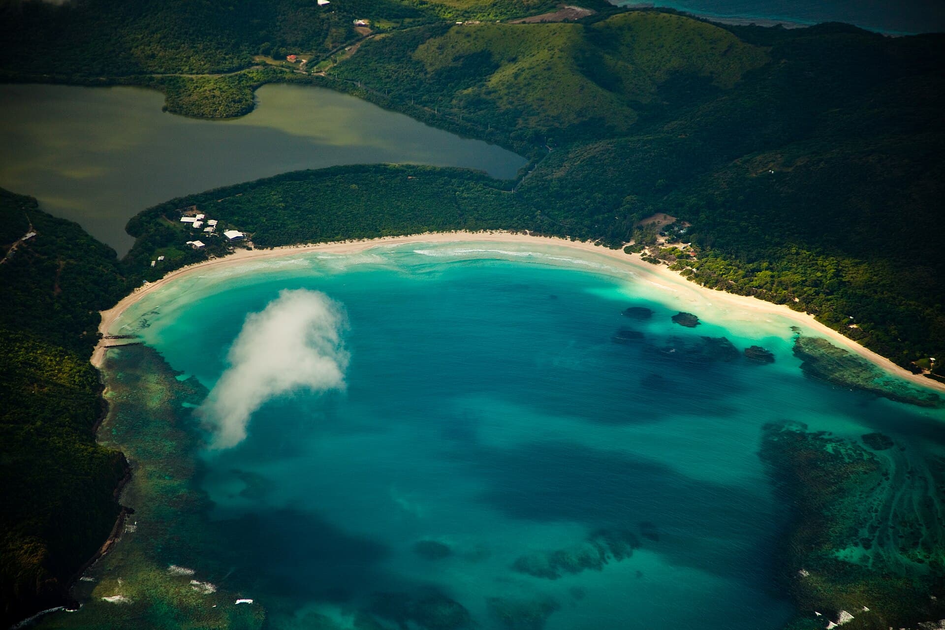 The turquoise curve of Flamenco Beach on Culebra from the air