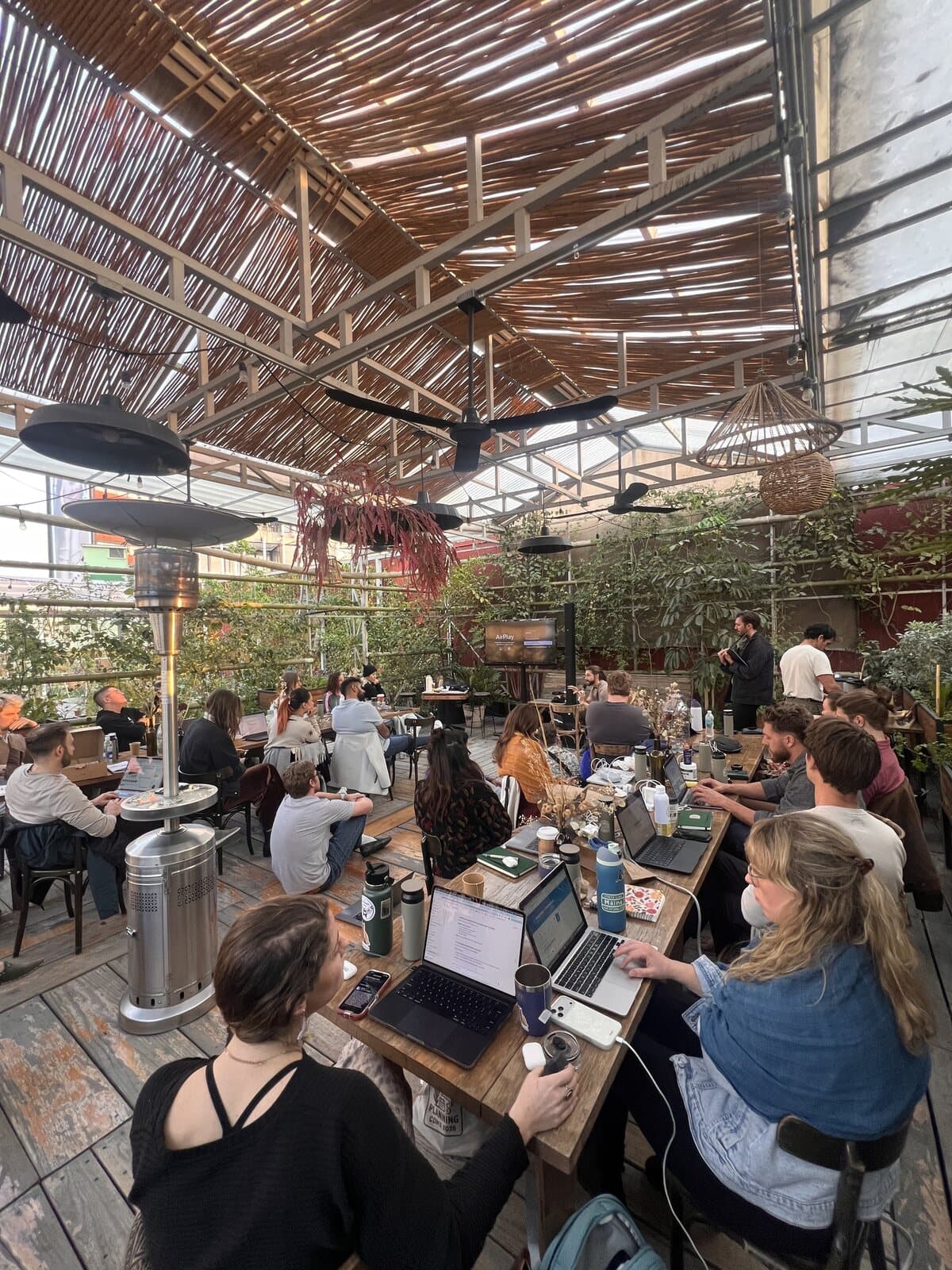 Long tables and laptops seen from above